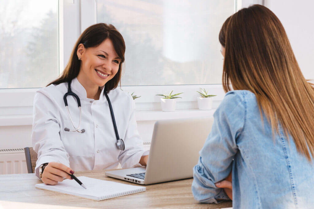 healthcare-financing-doctor-going-over-paperwork-with-patient