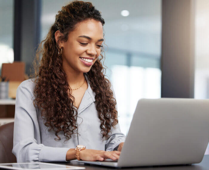 Girl happy working on computer